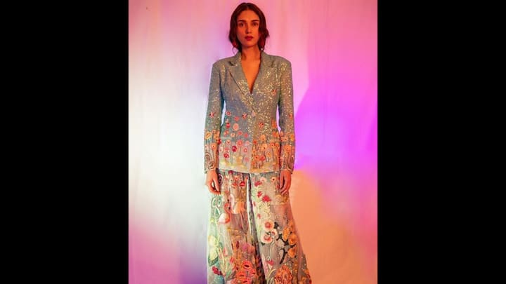 1. 8. ⁠Aditi Rao Hydari: Aditi Rao Hydari is known for her regal fashion sense, and her pastel blue embroidered co-ord set is nothing short of a masterpiece. The look featured a structured sequin blazer paired with wide-leg trousers, both adorned with vibrant floral embroidery that resembled a blooming garden. The sheer detailing on the pants added a whimsical touch, making the outfit stand out as wearable art. This co-ord set is a dream choice for fashion lovers who want to make a statement at high-profile festive events. (Image Source: Pinterest/avyanna06)