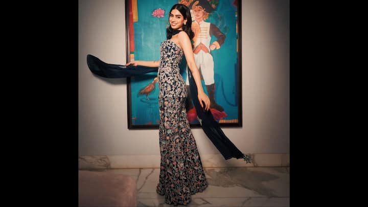 4. Khushi Kapoor: Khushi Kapoor is quickly becoming a style icon, and her ethnic co-ord look is proof of her chic fashion sense. She dazzled in a strapless navy-blue embroidered co-ord set that beautifully combined modern tailoring with intricate floral threadwork. The fitted silhouette highlighted her graceful frame, while the sheer dupatta added a traditional touch. With minimal jewellery, soft curls, and a radiant smile, Khushi let her outfit do all the talking. This look is an ideal festive pick for anyone who loves a balance of glamour and sophistication. (Image Source: Pinterest/yoonjichii)