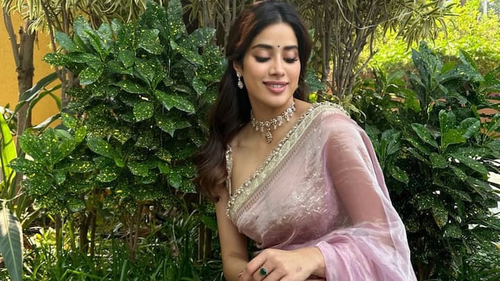 Tissue Silk Saree: Janhvi wore this sheer tissue silk saree with antique gold zari borders, draped in a classic style. The ensemble paired beautifully with her matching embroidered blouse. (Image Source: Instagram/ janhvikapoor)