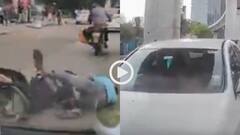 Vidoe: बिना देखे खोला कार का दरवाजा, कुचलने से बाल-बाल बचे स्कूटी सवार युवक, वीडियो वायरल