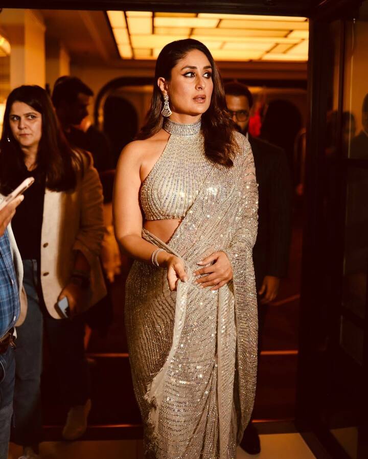 Her gold strappy heels added just the right touch of height and sophistication, elevating the entire outfit—both literally and stylistically.