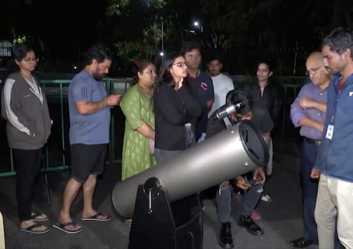 Enthusiasts gather at Jawaharlal Nehru Planetarium in Bengaluru to watch lunar eclipse. (PTI Photo)