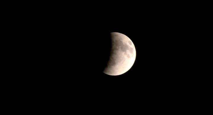 Total Lunar Eclipse 2025: Stunning ‘Capped Moon’ Lights Up Skies Across India — IN PICS The partial phase of the lunar eclipse as seen in Delhi when it began. Soon, the rare astronomical phenomenon, popularly known as the ‘Blood Moon’, will turn the lunar surface into a glowing crimson orb. (IANS Photo)