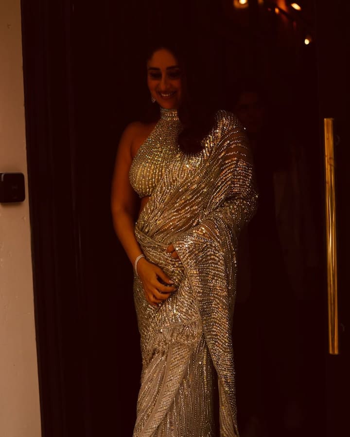 Keeping her glam aligned with the outfit's drama, Kareena's makeup was radiant and glowing. A soft base with highlighted cheekbones, muted peach-toned lips, and defined brows brought focus to her expressive eyes, which were enhanced with kohl and fluttery lashes.