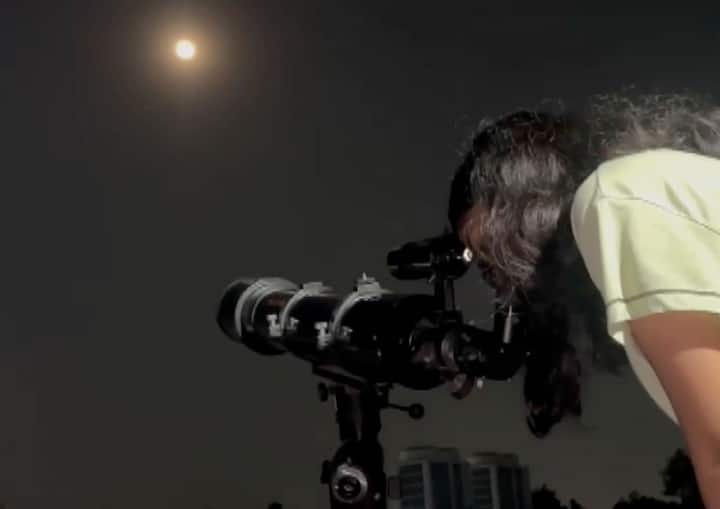 People gather to witness the Total Lunar Eclipse in Lucknow, UP as the partial phase begins. (ANI Photo)