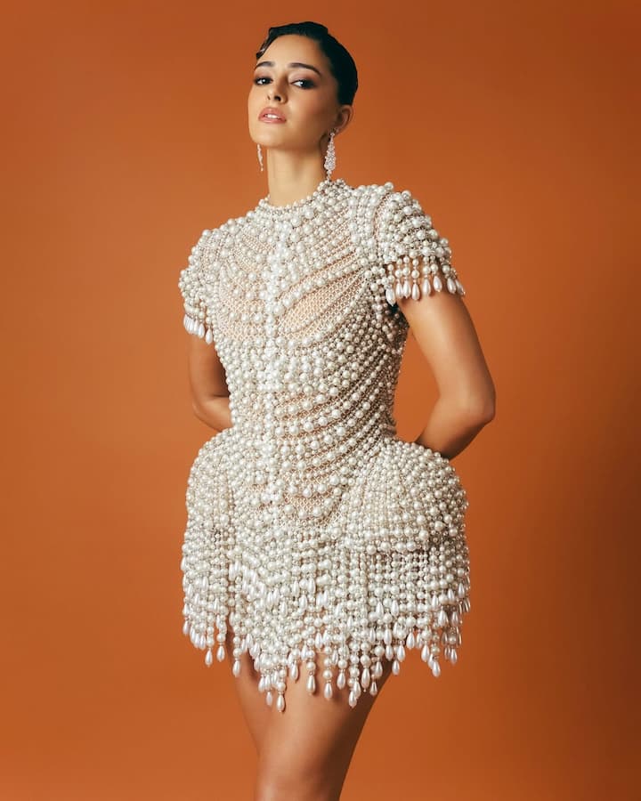 The young starlet donned a mini dress adorned with delicate pearls designed by the legendary duo Abu Jani and Sandeep Khosla, who are known for their mastery in combining traditional craftsmanship with contemporary silhouettes.