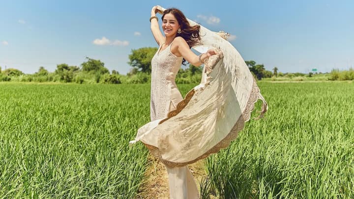 Day 2 – White: In this white sharara set, Ananya embodies grace with a sleeveless kurta adorned with stonework and butta-detailed sharara. The scalloped dupatta adds a touch of elegance, making this look serene yet festive. (Image Source: Instagram/ ananyapanday)