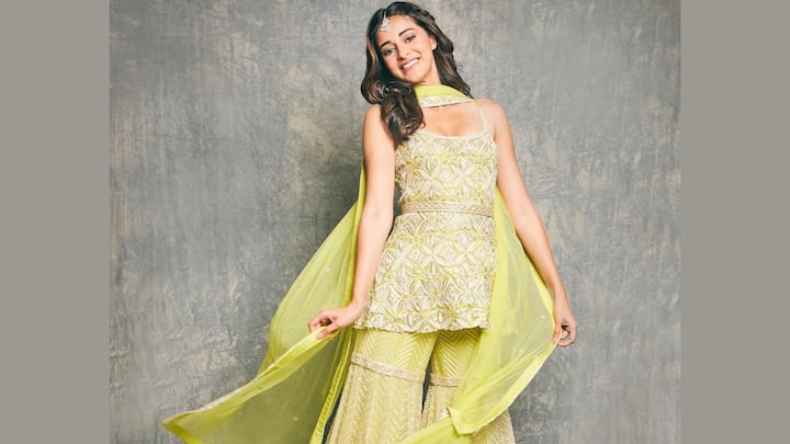 Day 5 – Yellow: Ananya’s vibrant yellow sharara set is full of joy and glamour. The strappy kurta and dupatta complement the silk-lined sharara, enhanced with metallic and threadwork details, creating a lively festive look. (Image Source: Instagram/ stylebyami)