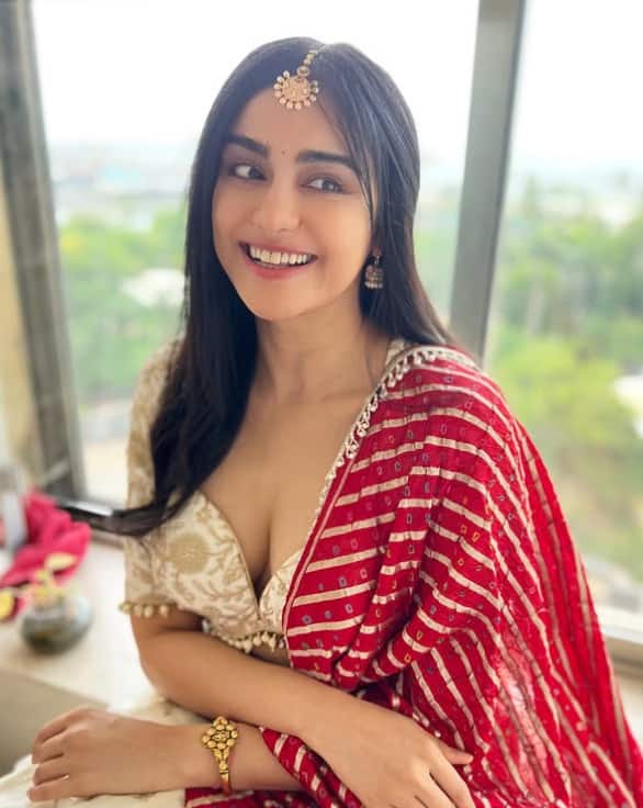Actress is looking beautiful with a red scarf with an off -white suit. The demand vaccine is adding four moons to his look.