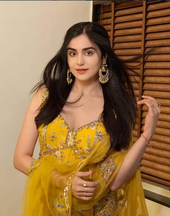 In this picture, Ada looks very beautiful in a yellow suit. His earrings and adorable smiles are making his look even more charming.