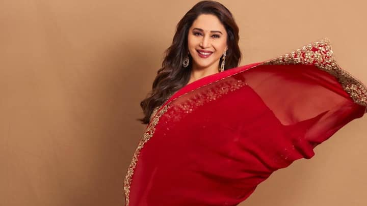 9 Days, 9 Colours Of Navratri: Madhuri Dixit Inspired Saree To Elevate Your Look Day 2 – Red: Her red chiffon saree with intricate embroidery radiates classic festive charm. The rich borders and a stylish blouse add just the right touch of glamour for Navratri celebrations. (Image Source: Instagram/ madhuridixitnene)