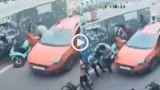 Video: सड़क किनारे खड़ी कार का अचानक गेट खुला, टकराकर गिरा स्कूटी चालक