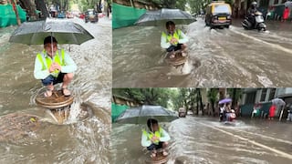Mumbai Rains: मुंबईकरांच्या सुरक्षेसाठी BMCचा कर्मचारी मॅनहोलच्या तोंडावर बसला, जीव धोक्यात घालून ड्युटी बजावली