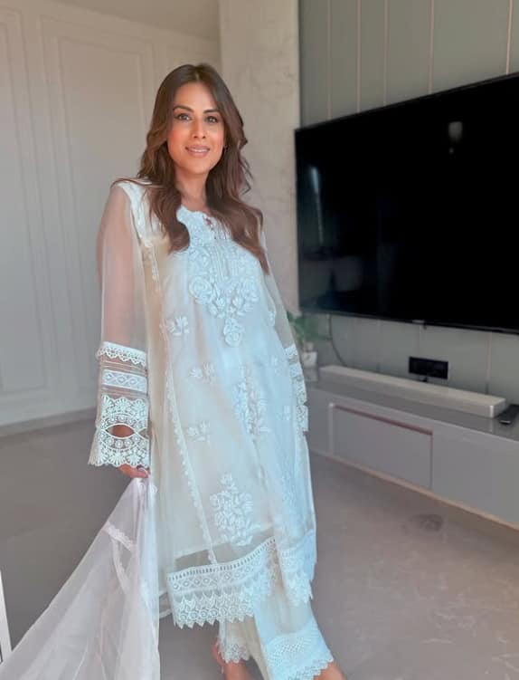 Be it ethnic or western she wreakes havoc in every look. She looks amazing in this white suit.
