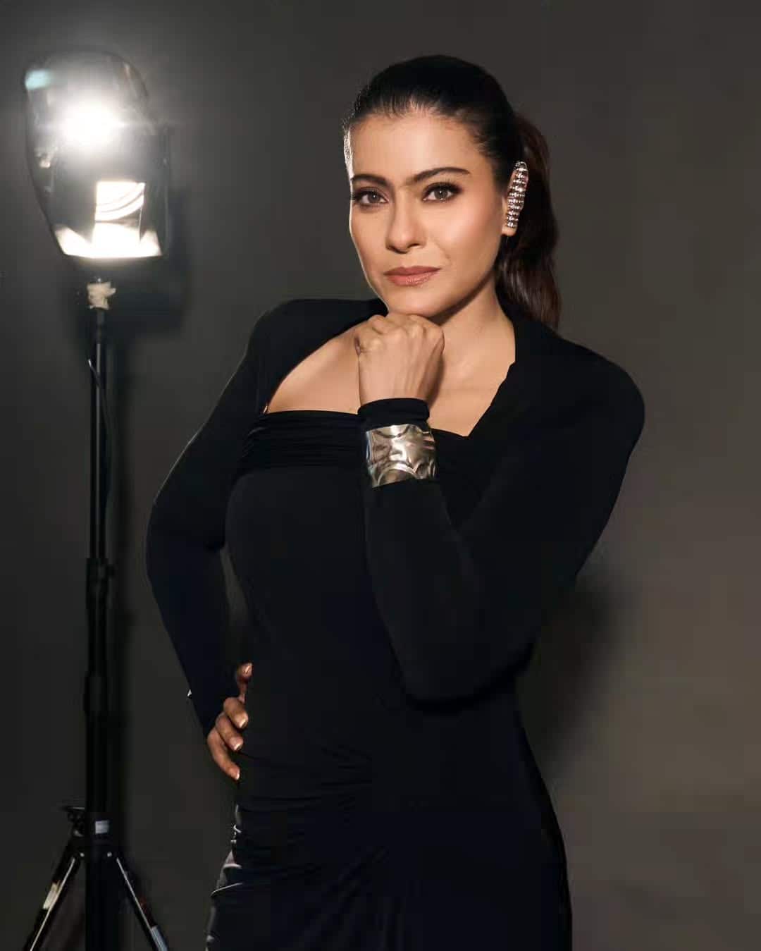 In a picture, Kajol is posing with a slight smile while looking at the camera. While looking at one side in the second, she is seen standing in a stylish style.