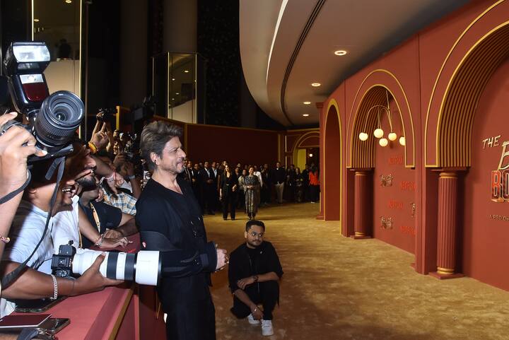 Shah Rukh Khan posed warmly with the paparazzi, radiating pride and joy.