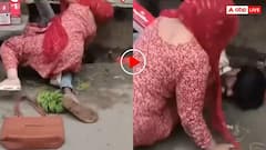 पत्नी ने मारा धोबी पछाड़! बाजार में मियां बीवी के बीच छिड़ा संग्राम, मैडम ने नाली में पटक पटक कर मारा- वीडियो वायरल