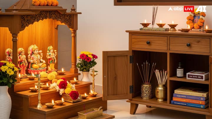 A Side Cabinet or Small Storage Unit: Every pooja corner needs storage for incense sticks, matchboxes, diya oil, cotton wicks, and prayer books. A small cabinet, drawer chest, or even a sideboard when kept near the mandir can prove to be quite helpful. Keeping these types of things in one place helps you avoid clutter and makes your pooja time more peaceful. (Image Source: ABP LIVE AI)