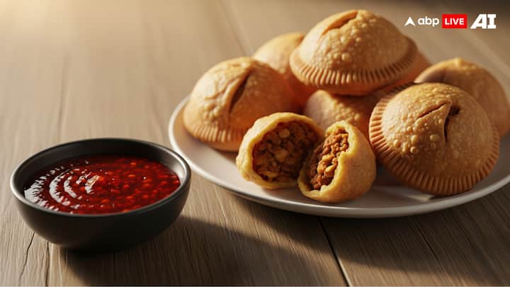 Hot Sauce + Kachori: In the first place, the spicy, flaky Indian puffed treat kachori is a flavor explosion. However, it becomes a spicy delight when hot sauce is added. The buttery crunch of the kachori and the rich, spiced lentil filling are expertly balanced by the sauce's intense, tangy spiciness, making every bite unforgettable. This combination will win hearts at game nights or family get-togethers and is perfect for festive evenings. (Image Source: ABP LIVE AI)