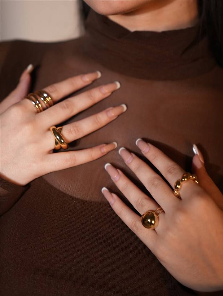 She complemented the outfit with golden accessories, including chunky rings and a statement ear accessory, enhancing the gown’s luxurious feel.