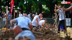 हंगरी में हुई अजीब प्रतियोगिता! हाथ में फावड़ा लेकर कब्र खोदने लगे दर्जनों लोग- यूजर्स ने पूछ डाले अजीब सवाल