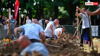 हंगरी में हुई अजीब प्रतियोगिता! हाथ में फावड़ा लेकर कब्र खोदने लगे दर्जनों लोग- यूजर्स ने पूछ डाले अजीब सवाल