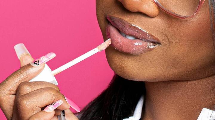 Gloss Finishes: Though mattes are sophisticated, a shiny lip can bring youthful brightness. Place a light gloss on top of your bold color of choice for extra depth and celebratory shine. (Image Source: Canva)