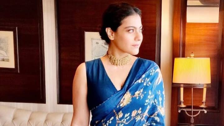 Kajol chose this floral royal blue saree from the Neelam Chakori Chidiya Chandni collection. She accessorized with a stone-embellished choker. (Image Source: Instagram/ radhikamehra)