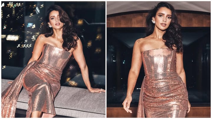 Triptii Dimri has been serving one stunning look after another lately. Her latest appearance in a glittery rose-gold sequined off-shoulder dress is proof of why she’s fast becoming a fashion favorite.