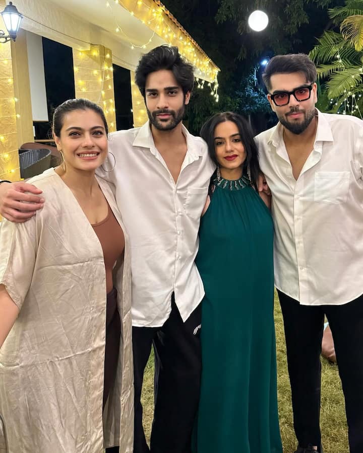 Here Neelam is looking very glamorous in green color halter neck dress. His son and sister -in -law Kajol are seen with him in the photo.