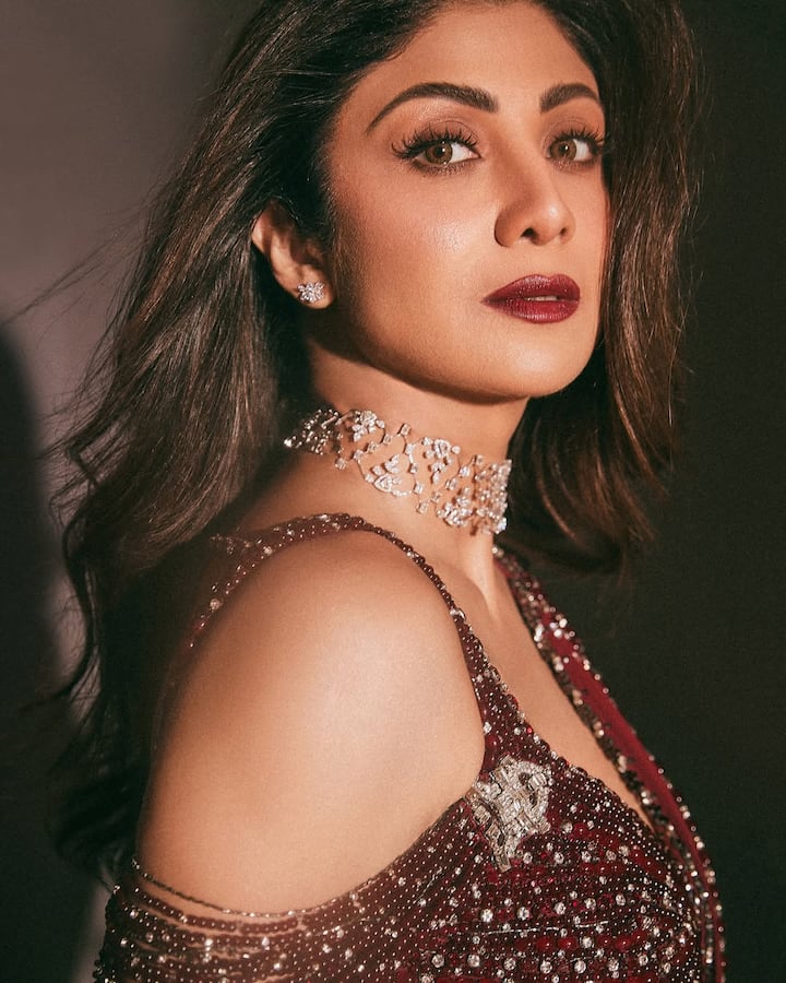 Shilpa Shetty stunned in a deep maroon embellished saree that beautifully blended traditional elegance with contemporary glam.