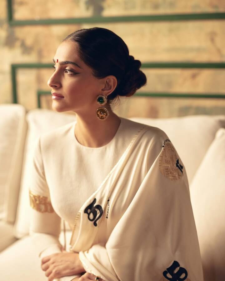 This hairstyle of Sonam Kapoor is an excellent option for Karva Chauth. They have kept their hair completely sleek. The hair is made in the back and made in a sleek low bun. It is a classic, minimal look that is perfect for traditional oxons.