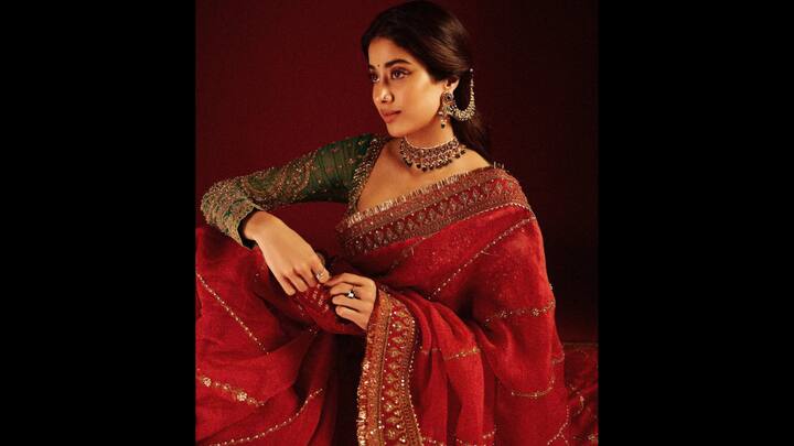 5. ⁠Janhvi Kapoor: For Karwa Chauth 2025 inspiration, Janhvi’s breathtaking red saree avatar is nothing short of regal. Draped in a richly embroidered red saree with intricate golden borders, the outfit is the epitome of elegance and festive grandeur. What makes this look stand out is the contrasting emerald green blouse embellished with heavy golden threadwork. The full-sleeved blouse adds a royal charm to her ensemble, making it a perfect choice for women who love blending bold tradition with festive glamour. (Image Source: Instagram/@janhvikapoor)