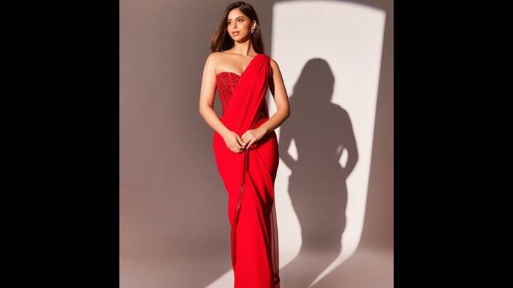 3. ⁠Suhana Khan: Suhana Khan redefines festive glamour in a modern Manish Malhotra red saree, making it a statement pick for Karwa Chauth 2025. The strapless corset-style blouse with intricate beadwork adds a bold contemporary twist, while the flowing drape keeps the look rooted in tradition. Sleek hair, minimal accessories, and her natural glow make this ensemble effortlessly chic. For those wanting to experiment beyond the conventional, Suhana’s fusion red saree proves that you can embrace tradition while staying fashion-forward. (Image Source: Instagram/@suhanakhan2)
