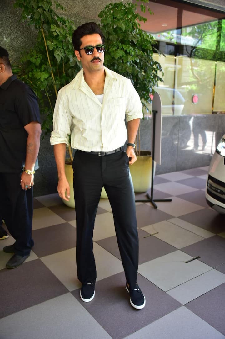 Vicky's swag was going to see in mustache. He posed fiercely for Paparaji.