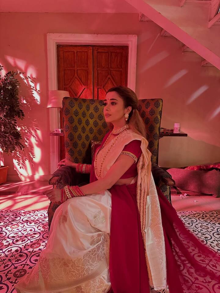 Tina Datta’s latest photoshoot captures her in a breathtakingly traditional avatar that perfectly blends elegance, nostalgia, and festive warmth. Dressed in a stunning crimson red saree paired with an ivory silk drape, Tina embodies the timeless appeal of Indian heritage fashion.