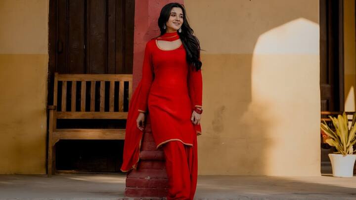 Turning heads in this classic red Patiala suit, Kanika brings back the traditional Punjabi flair. With golden lacework on the borders and dupatta, this look blends simplicity with festivity, a perfect pick for Karwa Chauth rituals. (Image Source: Instagram/ officialkanikamann)
