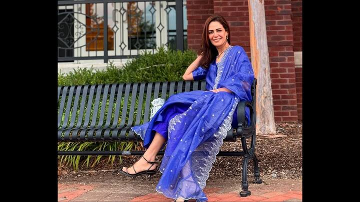 1. Royal Blue Suit: Mona Singh radiates effortless elegance in this stunning royal blue suit set. The delicate silver embroidery along the borders and scattered shimmer details add a regal touch, making it a perfect choice for Navratri, Karwa Chauth, or Diwali celebrations. Styled with minimal jewellery and strappy heels, Mona proves that simplicity and sophistication can go hand in hand. This outfit is a timeless festive inspiration for women who love understated glamour. (Image Source: Instagram/@monajsingh)