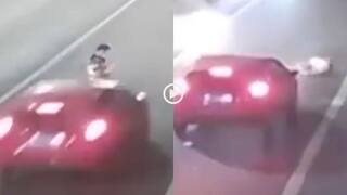 Video: फोन चलाते वक्त बीच सड़क पर खड़ा हो गया शख्स, कार वाले ने कराए यमराज के दर्शन, देखें वीडियो