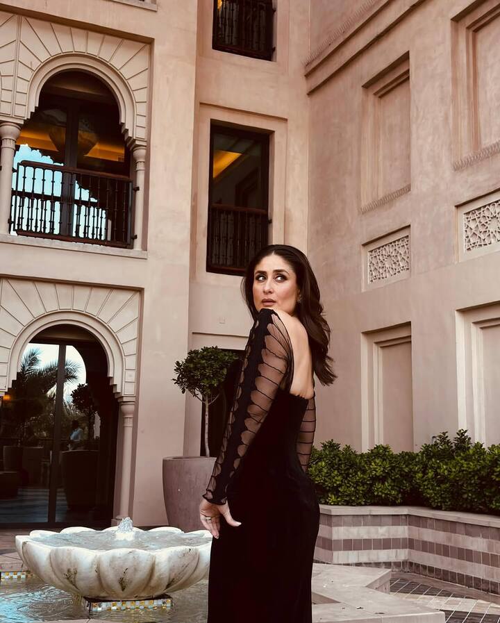 The true pièce de résistance? The dramatic, voluminous sleeves crafted from a sheer, almost gossamer fabric. These sculptural wings of delicate embroidery, signature to Rahul Mishra, added a breathtaking, almost gothic-glam drama to the ensemble.