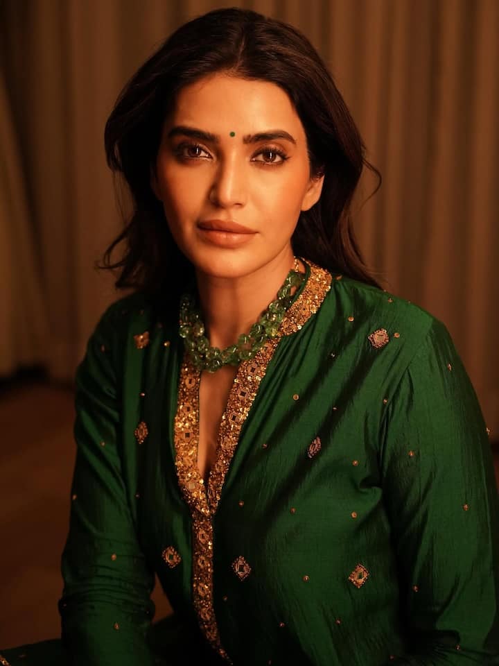Her choice of a bottle green sharara with golden detailing reflects her bold yet elegant style, perfectly capturing the spirit of Diwali celebrations. (All Image: Karishma Tanna/Instagram.)