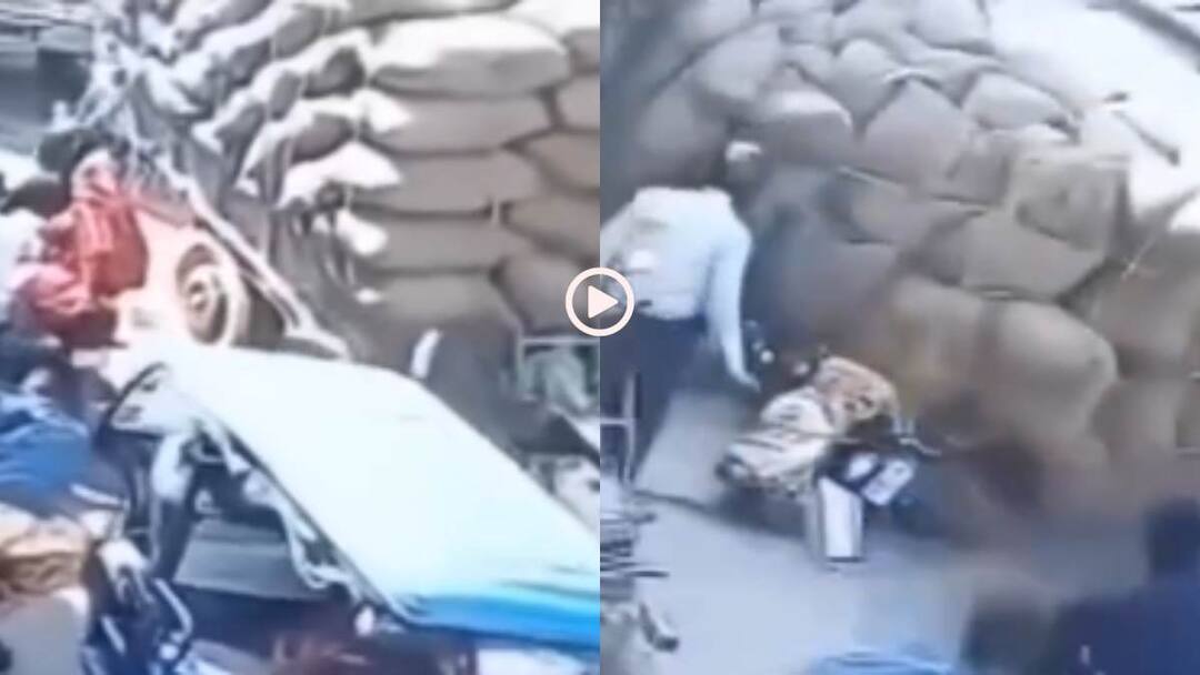 Video: भरे बाजार में लोगों पर पलटी ट्रैक्टर ट्रॉली, बोरियों के नीचे दब गए लोग, हादसे का वीडियो वायरल Watch tractor trolley overturned on peoples after losing balance due to weight Video goes viral Video: भरे बाजार में लोगों पर पलटी ट्रैक्टर ट्रॉली, बोरियों के नीचे दब गए लोग, हादसे का वीडियो वायरल