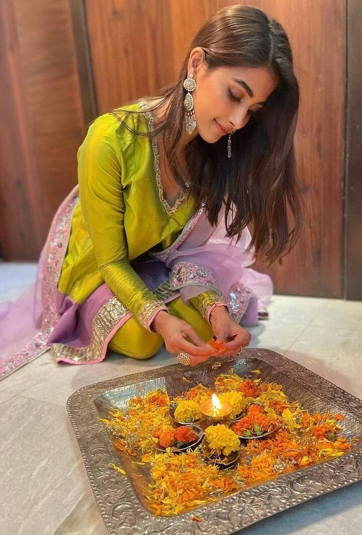 Like Pooja Hegde, you too can give a good pose with a lamp without looking into the camera. This photo of yours will go viral on the internet within a few minutes.