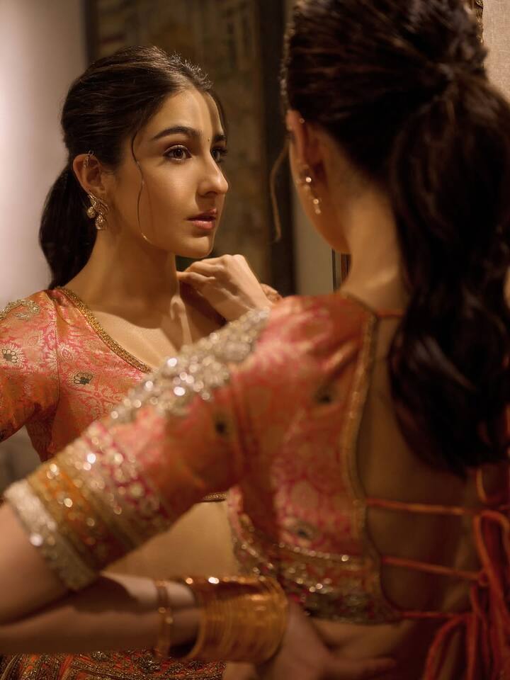 When it came to accessories, Sara kept her look understated yet elegant. A set of gold bangles, statement earrings, and a matching potli bag with dainty latkans elevated her traditional look without overpowering it.