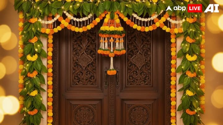 Final Touch With Marigolds And Lights: Complete your toran decoration by interspersing marigold flowers and stringing fairy lights or small diyas along the toran. The warm glow, combined with the natural leaves, adds vibrancy, joy, and a welcoming aura, making your home a true abode of Goddess Lakshmi this Diwali 2025. (Image Source: ABPLIVE AI)