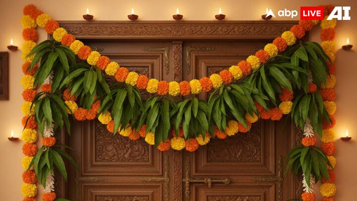 Mango Leaf Toran: Mango leaves are widely used for their auspicious qualities. Creating a toran of mango leaves, and adding marigold flowers in between, increases both the decorative appeal and spiritual significance of your entrance. It is said to purify the environment and invite positive vibrations. (Image Source: ABPLIVE AI)