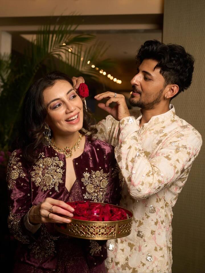 In this picture, Darshan is seen lovingly putting flowers in his wife's hair.