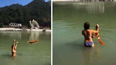 Video: गळ्यात झंडूच्या फुलाचा हार, डोळ्यावर गाॅगल अन् चक्क बिकिनी घालून परदेशी महिलेची गंगेत डुबकी; ऋषिकेशमधील व्हायरल व्हिडिओने सोशल मीडियात खळबळ