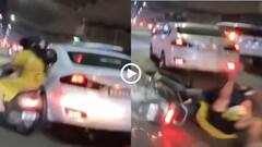 Video: सड़क पर अंधाधुंध दौड़ाई कार, स्कूटी सवार कपल को मारी टक्कर, घिसटती गई महिला, देखें वीडियो