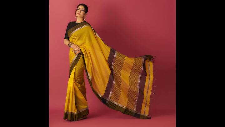 8. Classic Mustard Silk Saree: The actress recently stunned in a mustard yellow silk saree, proving that timeless weaves never go out of style. Raveena’s saree features a rich mustard base with contrasting olive green and maroon borders, adding a beautiful play of earthy tones. The saree’s fine texture and soft sheen highlight the craftsmanship of traditional Indian weaving, making it an instant festive favourite. Paired with a solid black blouse, the look strikes a perfect balance between contemporary and traditional. The sleek pairing amplifies the saree’s vibrancy while keeping the overall look crisp and refined. This mustard silk saree is a celebration of Indian elegance. (Image Source: Instagram/@officialraveenatandon)